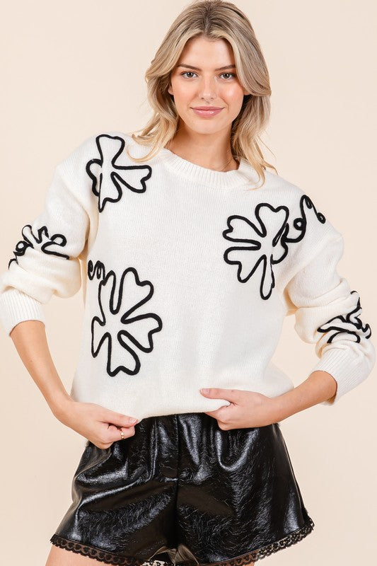 Pull au design réfléchi