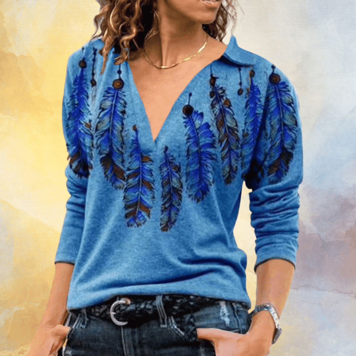 EP | Pull bleu avec motif à plumes
