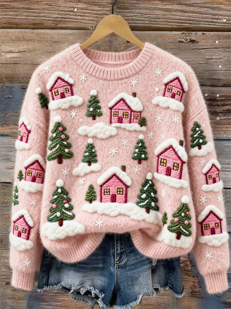 Pull en coton avec maisons de village roses et arbres à feuilles persistantes