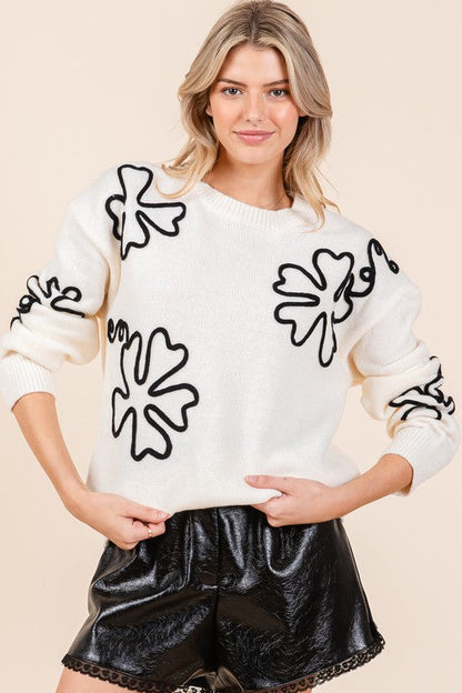 Pull au design réfléchi