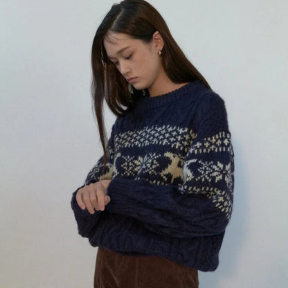 Pull au design réfléchi
