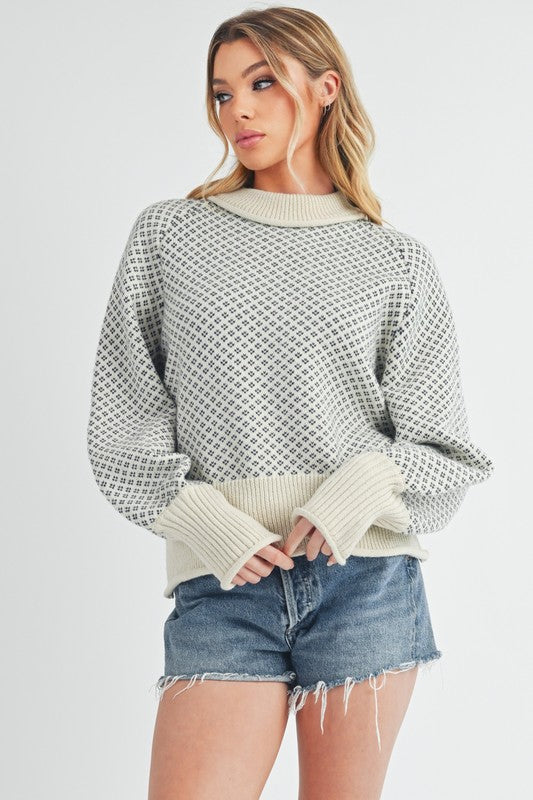 Pull au design réfléchi