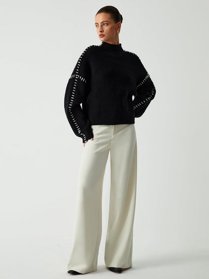Pull au design réfléchi