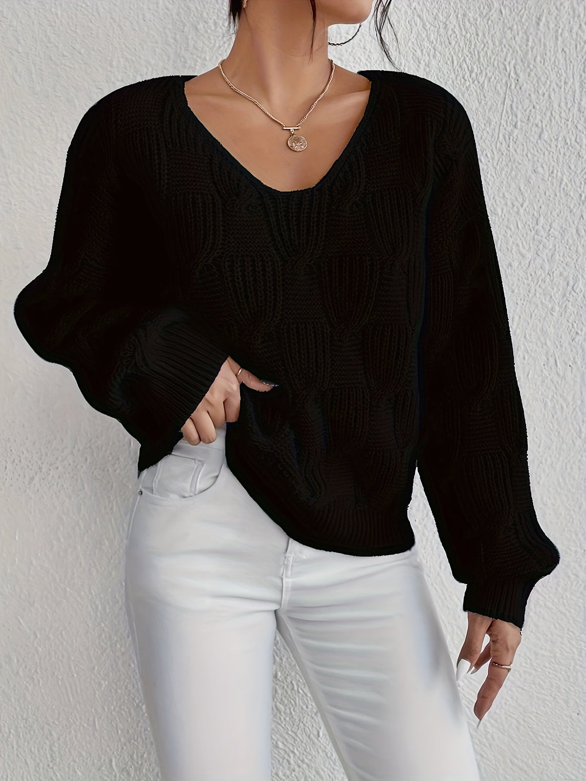 Pull au design réfléchi